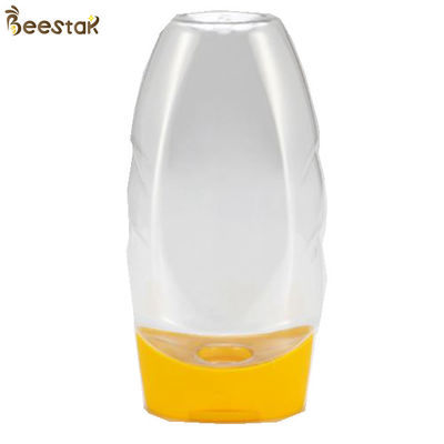 kaufen Nahrungsmittel-Grad-Plastik- Fabrikpreis spezieller Plastik-Honey Jar And Spoon 335ml leer on-line-Fertigung