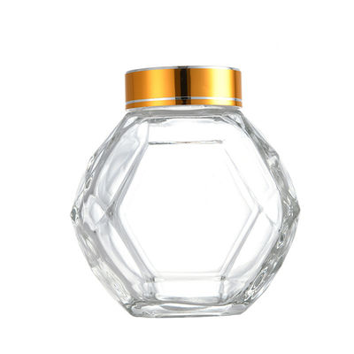kaufen Glashexagon-Honey Bottle With Golden Silvers 200ML 380ML roter schwarzer Metalldeckel on-line-Fertigung
